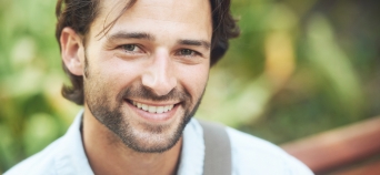 Man smiling after restorative dentistry treatment